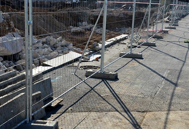 temporary fence panels protecting a construction site from unwanted access